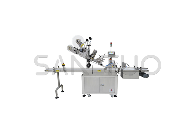 Upper surface labeling machine